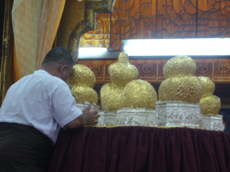 Gold leaf gets rubbed into the buddhas to the extent that they are no longer recognisable.